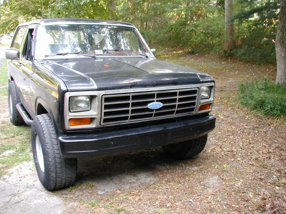 Black 1980s Ford Bronco front quarter view, parked outdoors
