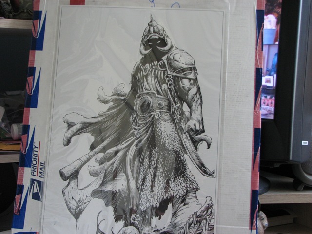 Drawing of a warrior in armor with a cape, inside a protective sleeve with 'PRIORITY MAIL' tape