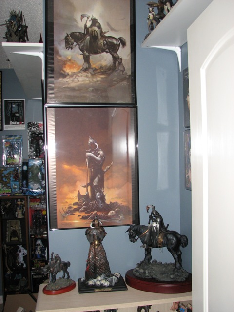 1991 Ford Bronco - A collection of fantasy art and figurines are displayed on shelves and a table.
