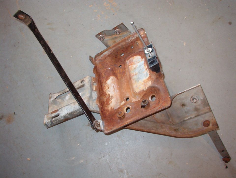 SOLD Auxilliary Battery Tray with Taurus-style (long) hold-down bolt.
Probably from an '87-91 diesel.

Fits behind left headlight & relocates washer/overflow tank