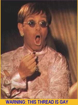 1995 Ford Bronco - A man with a surprised expression, wearing a pink patterned shirt and round glasses, is shown in this photograph.