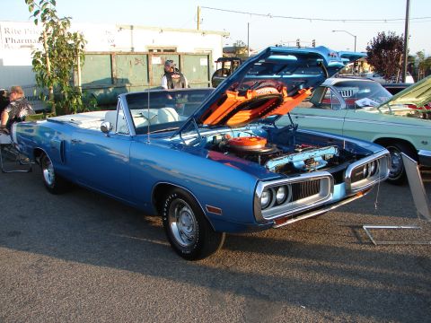 1992 Ford Taurus - A blue 1970 Dodge Super Bee convertible is displayed with its hood open, revealing the engine bay.