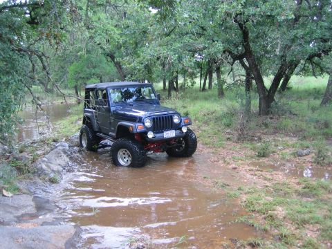 2001 Jeep Wrangler - This 2001 Jeep Wrangler is navigating a water obstacle off-road.