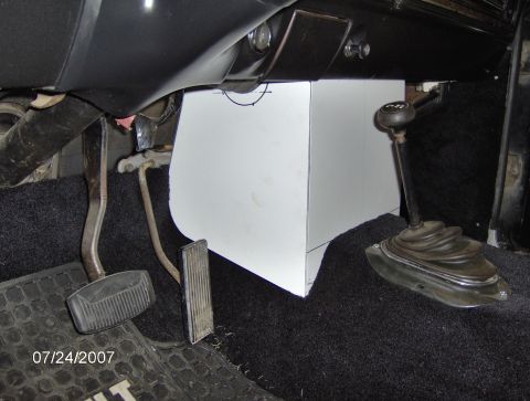 1978 Ford Bronco - The interior shows floor pedals, a floor shifter, and a custom-built white console box.