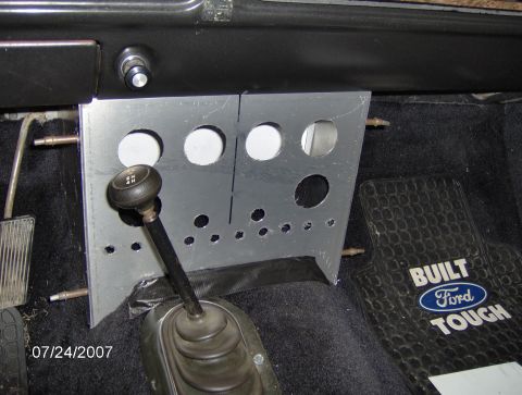 1978 Ford Bronco - Interior view of a custom dashboard panel and shifter, accompanied by a "Built Ford Tough" floor mat.