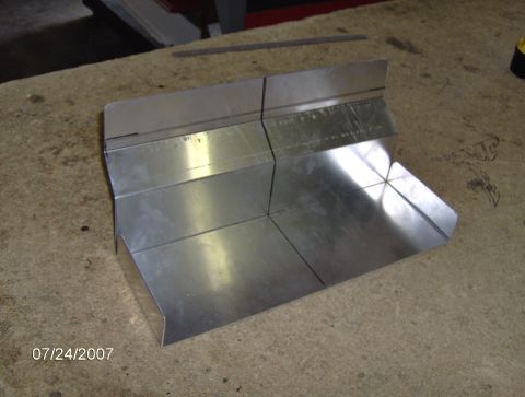 1978 Ford Bronco - A custom-fabricated metal component is shown on a work surface, with a date stamp visible in the corner.