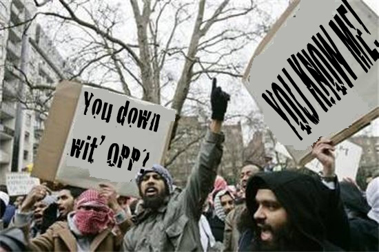 Protestors hold signs reading "You down wit' OPP?" and "YOU KNOW ME."