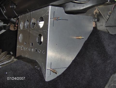 1978 Ford Bronco - This custom aluminum console features numerous circular cutouts for gauges, installed in a vehicle's interior.