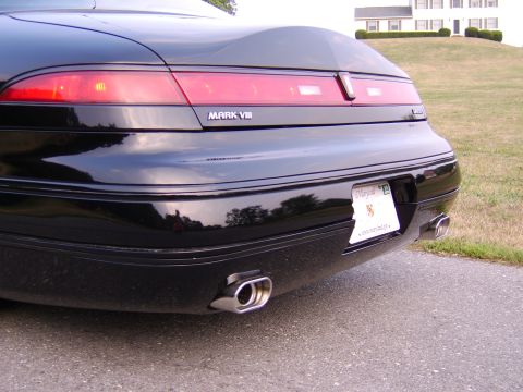 1996 Mercury Grand Marquis - Rear view of a black Lincoln Mark VIII, dual exhaust tips and a Maryland license plate.