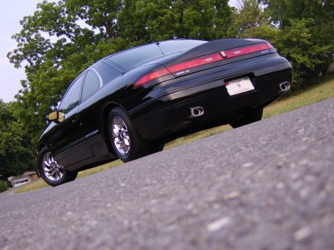 1996 Mercury Grand Marquis - This Lincoln Mark VIII has a distinctive rear design with a full-width taillight bar and dual exhaust tips.