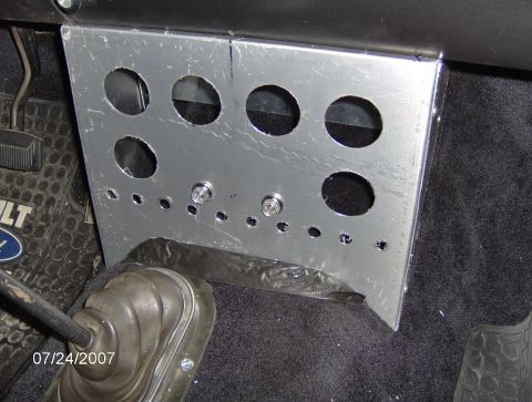 1978 Ford Bronco - Interior shot shows a custom aluminum panel with multiple circular cutouts for gauges, installed in a vehicle.
