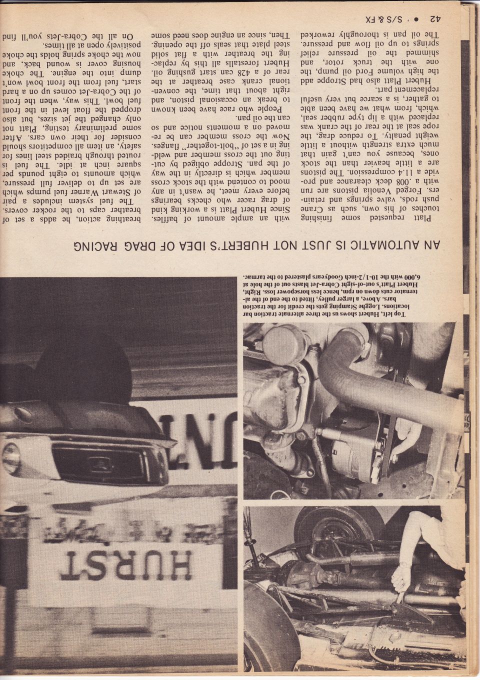 Close-up of a car's engine and suspension components, with "HURST" visible on a sign