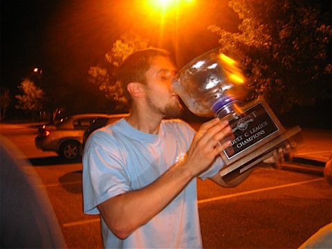 1985 Ford LTD Crown Victoria - A man celebrates a hockey championship by drinking from the trophy.