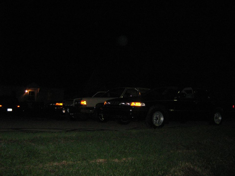 1988 Mercury Grand Marquis and other cars parked at night