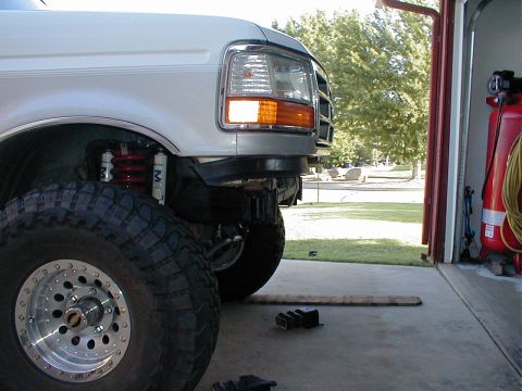 1996 Ford Bronco - Front view of a 1996 Ford Bronco, focusing on the bumper and oversized tire.