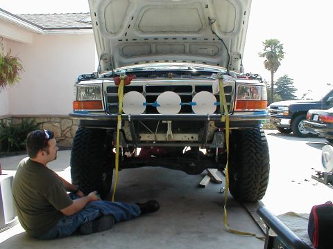 1996 Ford Bronco - Front view of a 1992 Ford Bronco undergoing work, with its hood open and custom bumper installed.