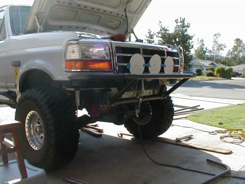 1996 Ford Bronco - Front view of a 1996 Ford Bronco, its custom bumper and off-road tires.