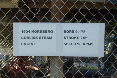1994 Ford F-150 - A sign describes a 1904 Nordberg Corliss steam engine, detailing its bore, stroke, and speed.