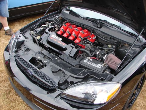 1993 Ford Taurus - Engine bay of a Ford Taurus SHO, showing the V8 engine and custom intake.