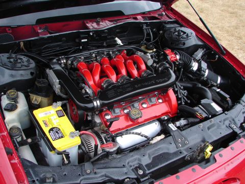1993 Ford Taurus - Engine bay view shows a 3.0L DOHC SHO V6 engine with a yellow Optima battery.