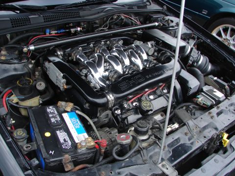 1993 Ford Taurus - The engine bay of a 1993 Ford Taurus SHO, chrome intake runners and clear "SHO 24 VALVE DOHC" badging.