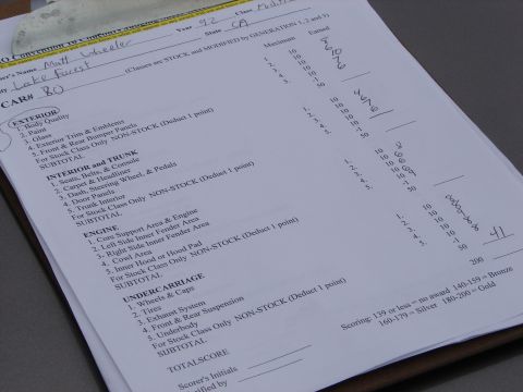 1993 Ford Taurus - A car show scoring sheet details the evaluation of a vehicle, with a year noted as '92'.