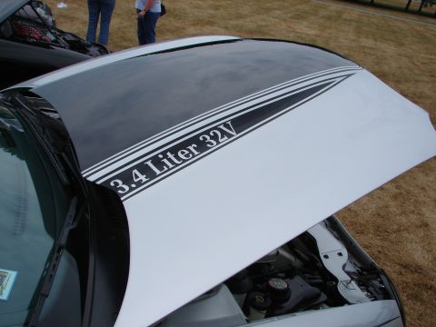 1993 Ford Taurus - Hood features "3.4 Liter 32V" graphics. Another vehicle is partially visible to the left.