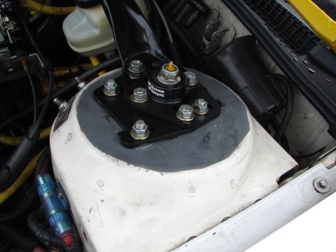 1993 Ford Taurus - The strut mount in the engine bay has 'Maximum Motorsports' branding visible on its housing.