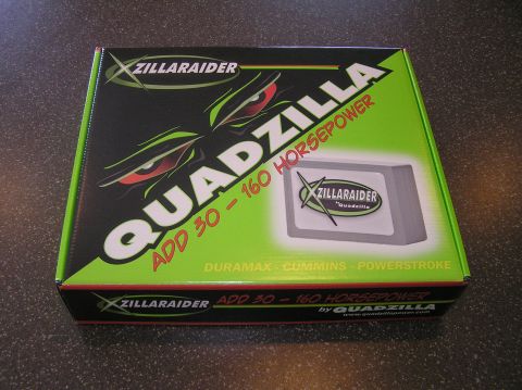 2000 Ford Excursion - Box for a QuadZilla performance chip, compatible with Duramax, Cummins, and Powerstroke engines.