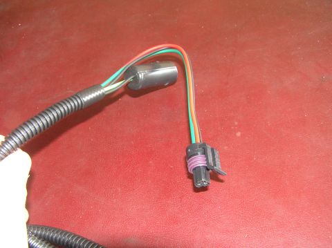 2000 Ford Excursion - Close-up of a vehicle wiring harness connector with multiple colored wires.