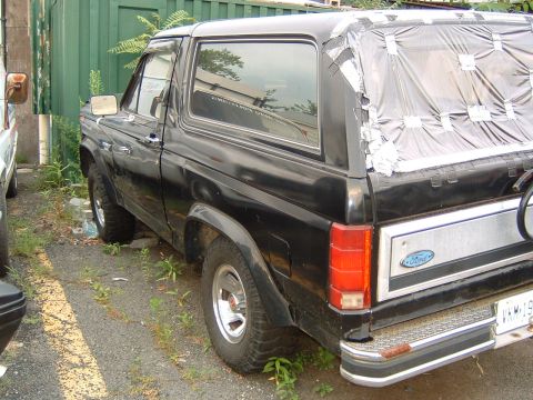 1986 Ford Bronco - This black Ford Bronco appears to be from the early 1980s, not 1986, based on its body style.