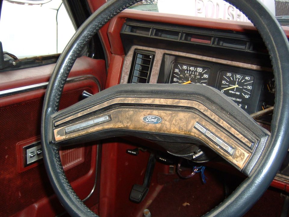 1986 Ford Bronco interior with woodgrain trim and gauges