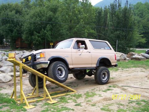 1979 Ford F-150 - This lifted 1987 Ford Bronco is positioned on a yellow ramp, its off-road capabilities.