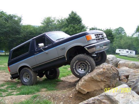 1979 Ford F-150 - This lifted Ford Bronco is navigating a rocky obstacle course.