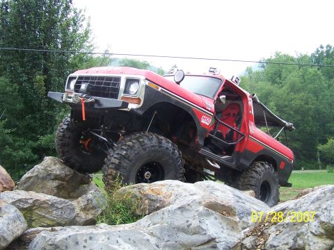 1979 Ford F-150 - Modified 1979 Ford F-150 navigates a rocky obstacle course with its doors open.