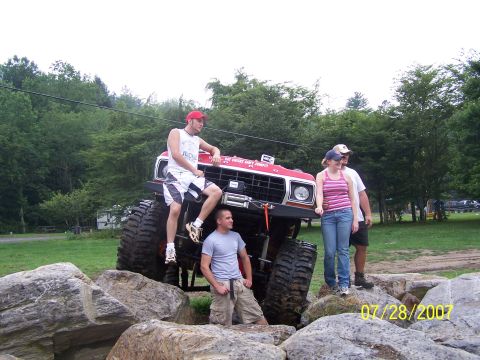 1979 Ford F-150 - Modified 1979 Ford F-150 truck with people posing on and around it during an off-road event.