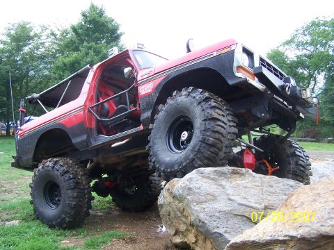 1979 Ford F-150 - This heavily modified 1978 Ford Bronco is equipped for extreme off-roading, navigating a rocky terrain.