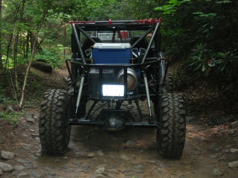 1992 Ford Mustang - Custom buggy with roll cage and large tires navigating a wooded trail.