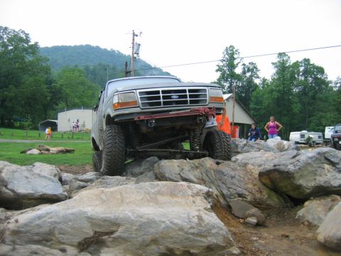 1992 Ford Mustang - Ford F-Series truck tackling a challenging rock crawling course.