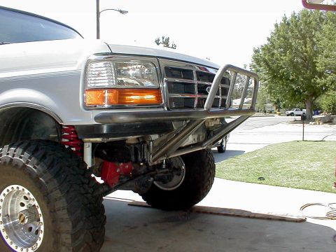 1996 Ford Bronco - Front view of a 1996 Ford Bronco a custom brush guard and lifted suspension.