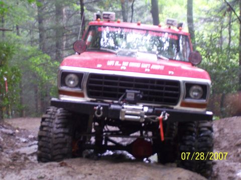 1979 Ford F-150 - Modified 1979 Ford F-150 truck with large tires and winch, seen off-road.