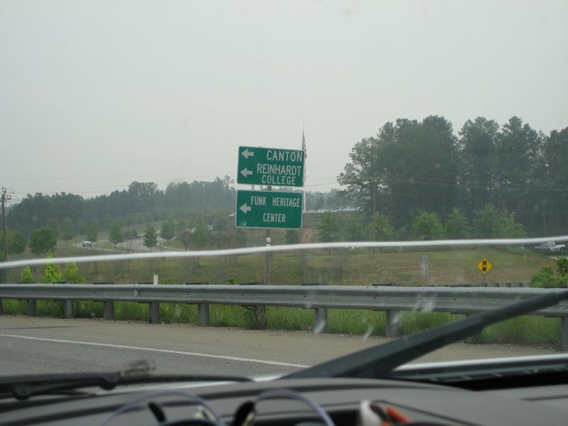 Highway directional signs for Canton, Reinhardt College, and Funk Heritage Center