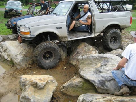 1995 Ford Bronco - This modified Ford Bronco is attempting to traverse a rocky obstacle course.