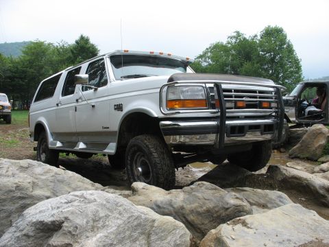 1995 Ford C-350 (Centurion Conversions) - This 1995 Ford C-350 Centurion Conversions SUV navigates a rocky trail.