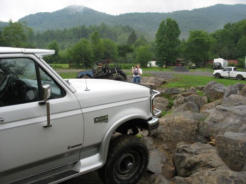 1995 Ford C-350 (Centurion Conversions) - White 1995 Ford C-350 (Centurion Conversions) is part of a group of vehicles in a rocky, mountainous area.