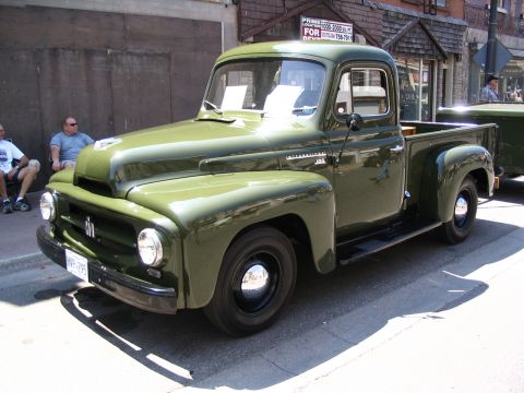 1993 Ford Taurus - This vintage International pickup truck, likely a 1953 model, is displayed at a car show.