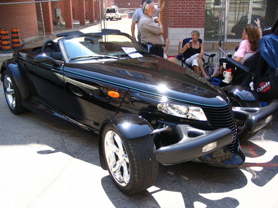 Black convertible with distinctive front end and chrome wheels