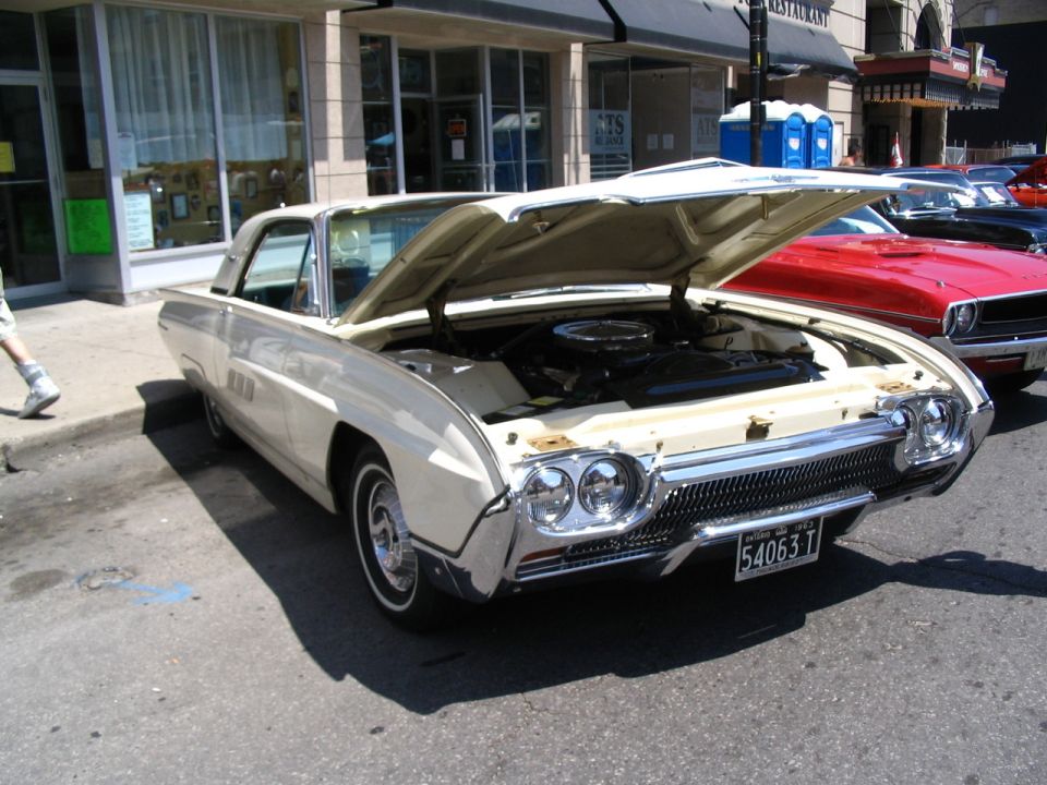 Cream 1963 Ford Thunderbird with hood open, front view