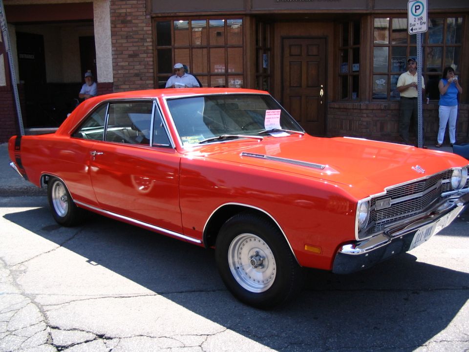 Red 1968 Dodge Dart parked on street, front quarter view