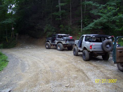 1978 Ford Bronco - Two Ford Broncos are parked on a gravel road in a wooded area, with a date stamp of 07/27/2007 visible.